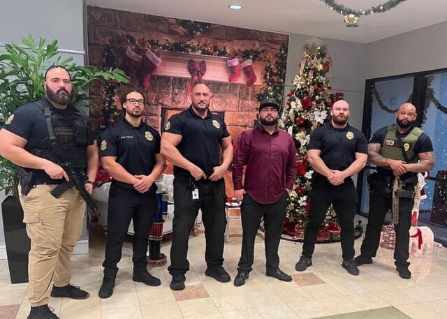 The Enhance security team poses during the holiday season for a photo posted on social media.