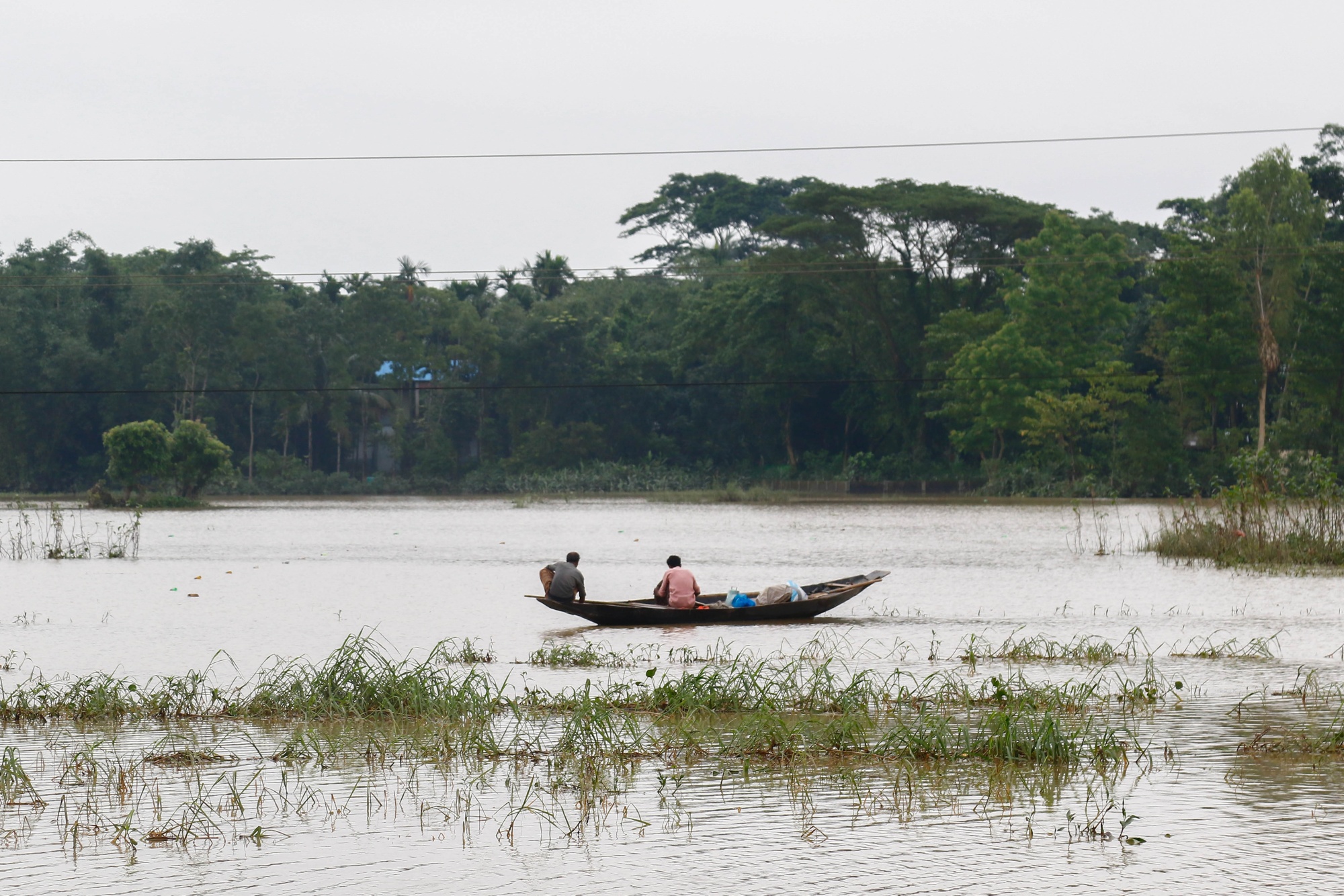A paddy field submerged in floodwater in Sylhet, Bangladesh, on June 24.
