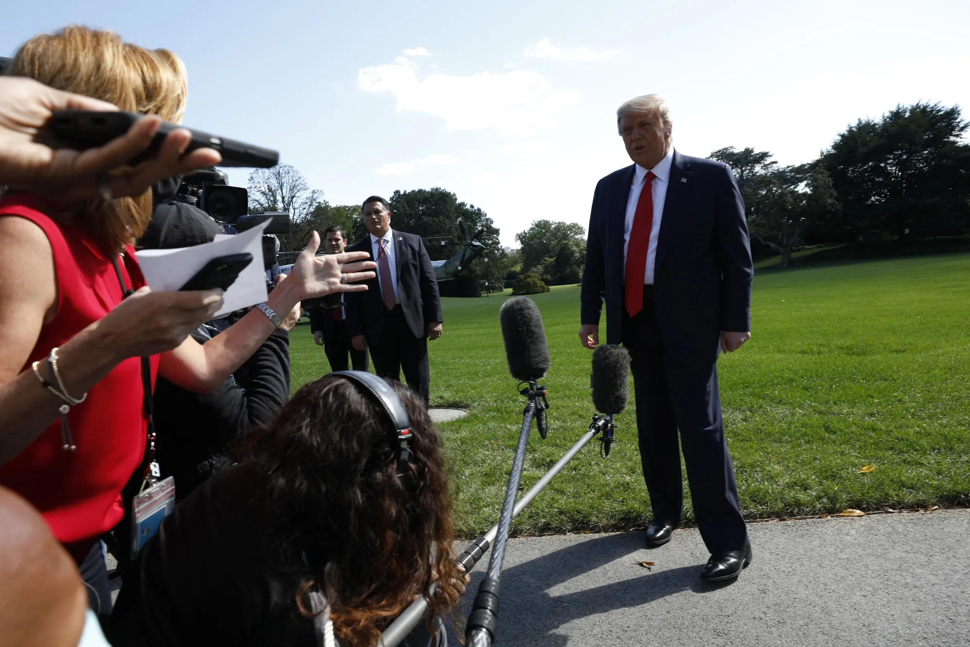 Donald Trump speaks to members of the media before boarding Marine One on the South Lawn of the White House on Sept. 30.