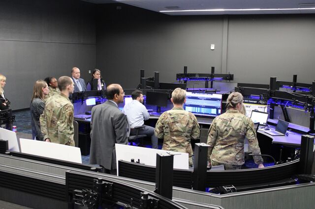 <span style="color:#818181; font-size:110%; font-weight:bold">● US Air Force officers touring the soon-to-open ISAC watch center.</span>