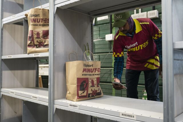 A wish-master picks up an order en-route to fulfilling a 10 minute delivery at a Flipkart dark store in Bengaluru.