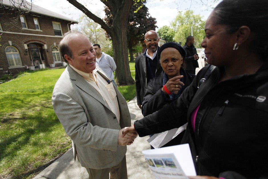 Mayor Mike Duggan visits Detroit's Boston Edison neighborhood for a May 2014 house auction.