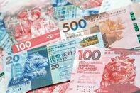 Hong Kong Dollar, Chinese Yuan and US Dollar Banknotes As Currency Peg Intervention From HKMA Continues Into Third Day