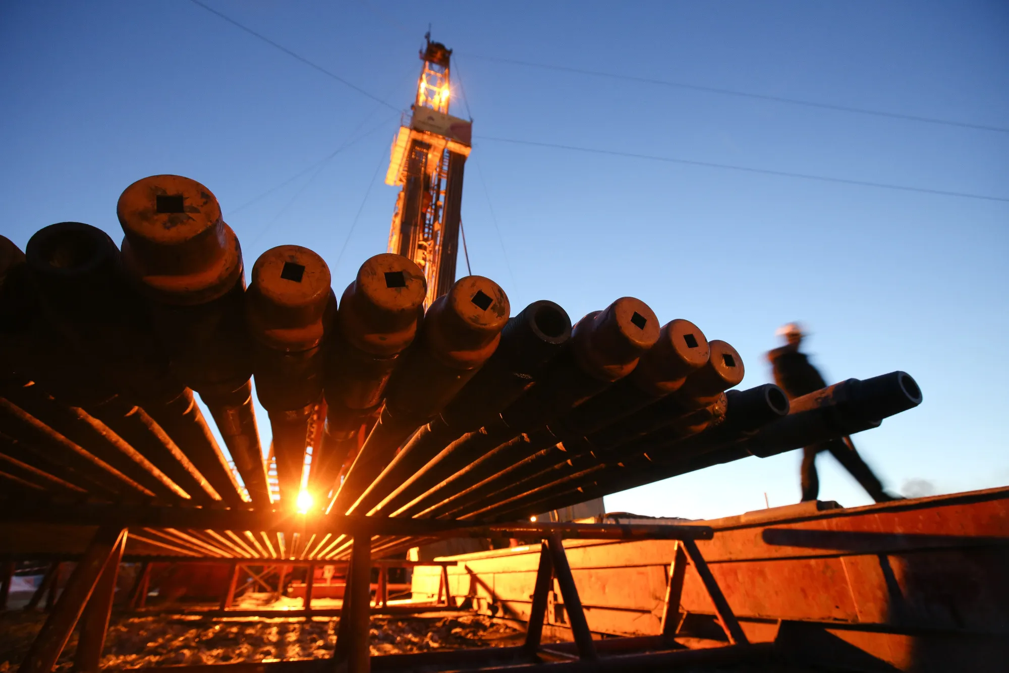 An oil drilling rig and drill pipes in the Samotlor oilfield near Nizhnevartovsk, Russia.