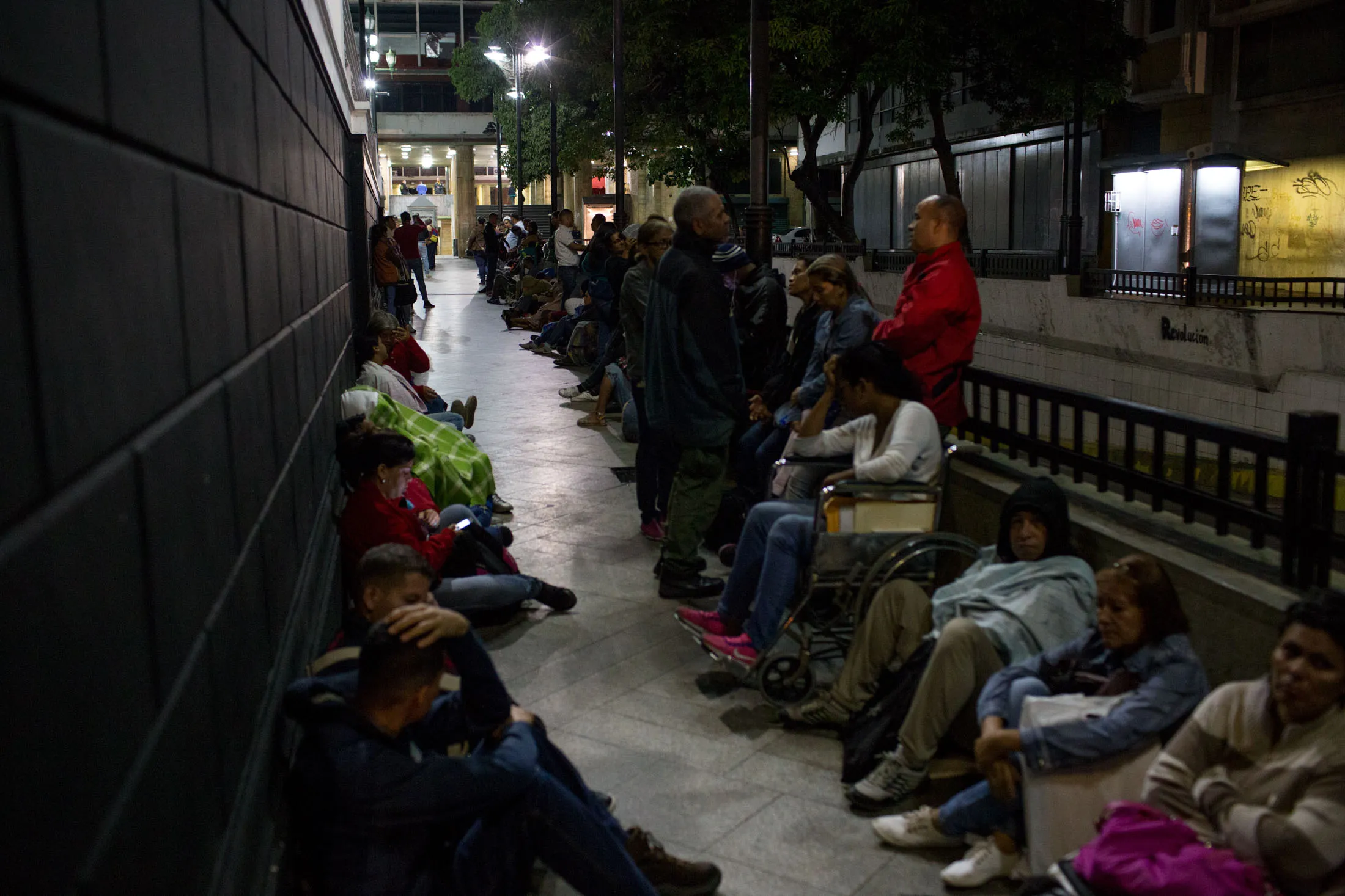People wait in line overnight to apply for passports at the Administrative Service of Identification, Migration, and Foreigners&nbsp;in Caracas.
