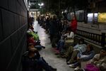 People wait in line overnight to apply for passports at the Administrative Service of Identification, Migration, and Foreigners&nbsp;in Caracas.