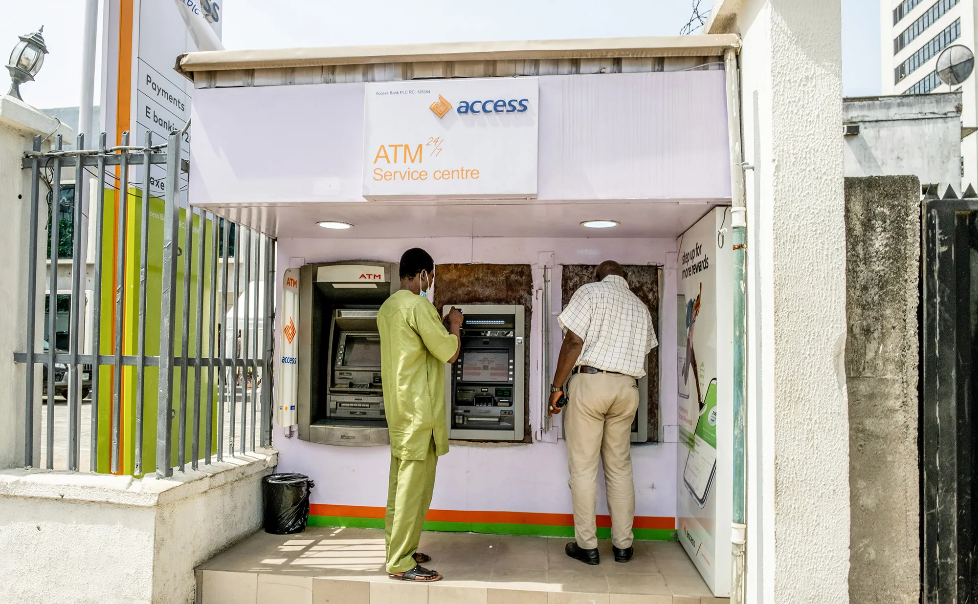 Customers use ATMs&nbsp;outside an Access Bank&nbsp;branch in Lagos, Nigeria.