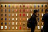 Customers browse Apple Inc. smartphone cases during a sales launch at a store in Chicago, Illinois, U.S., on Friday, Sept. 21, 2018. The iPhone XS is up to $200 more expensive than last years already pricey iPhone X and represents one of the smallest advances in the product lines history. But that means little to the Apple Inc. faithful or those seeking to upgrade their older iPhone.