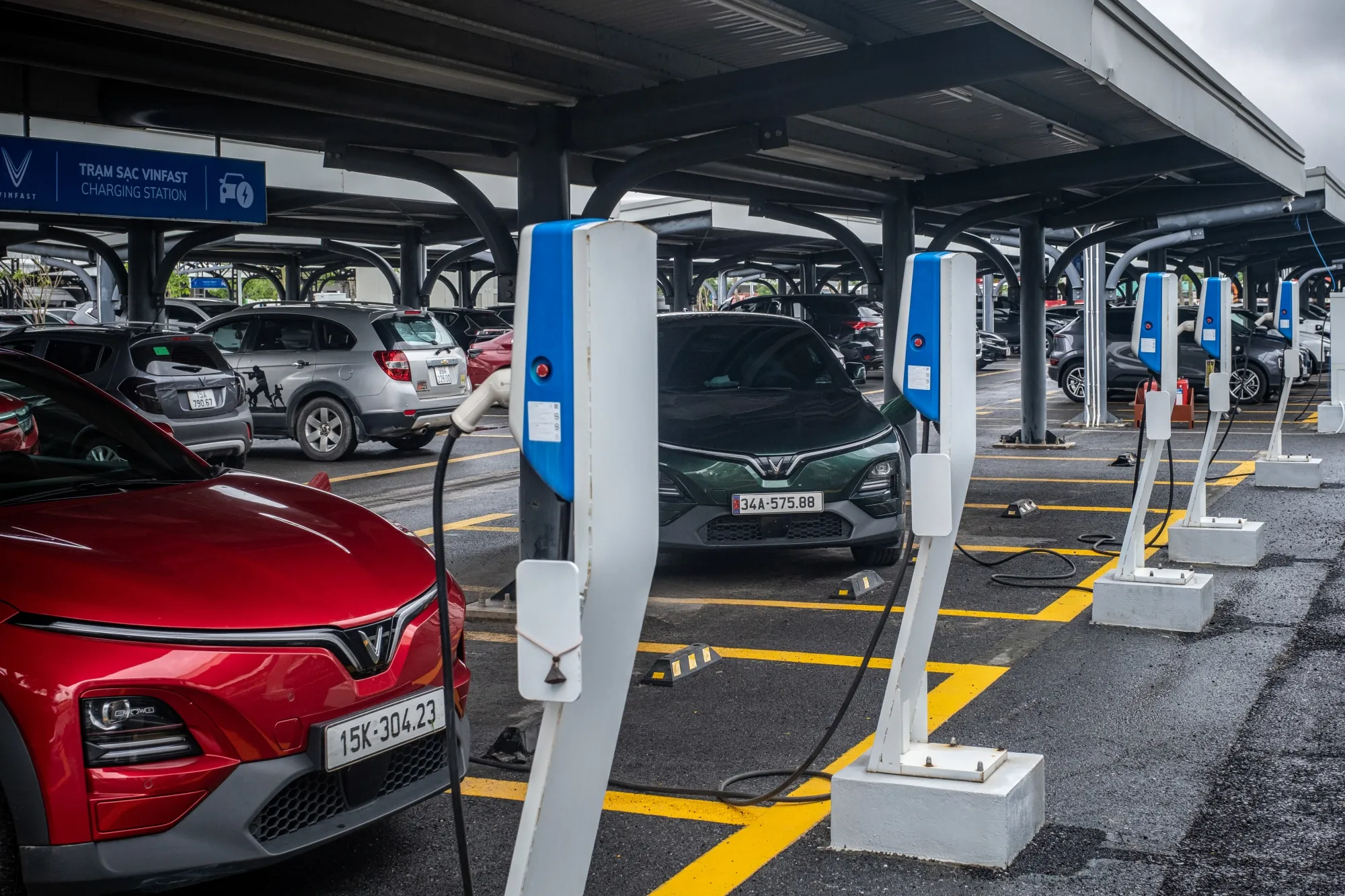 A VinFast electric vehicle&nbsp;charges at the garage of the company's manufacturing complex in Hai Phong, Vietnam.