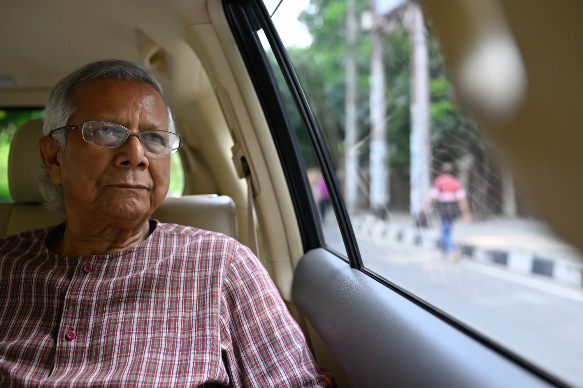 Muhammad Yunus, a Nobel Peace Prize-winning economist, on his way to attend a court hearing in Dhaka, Bangladesh, on May 2, 2024.&nbsp;