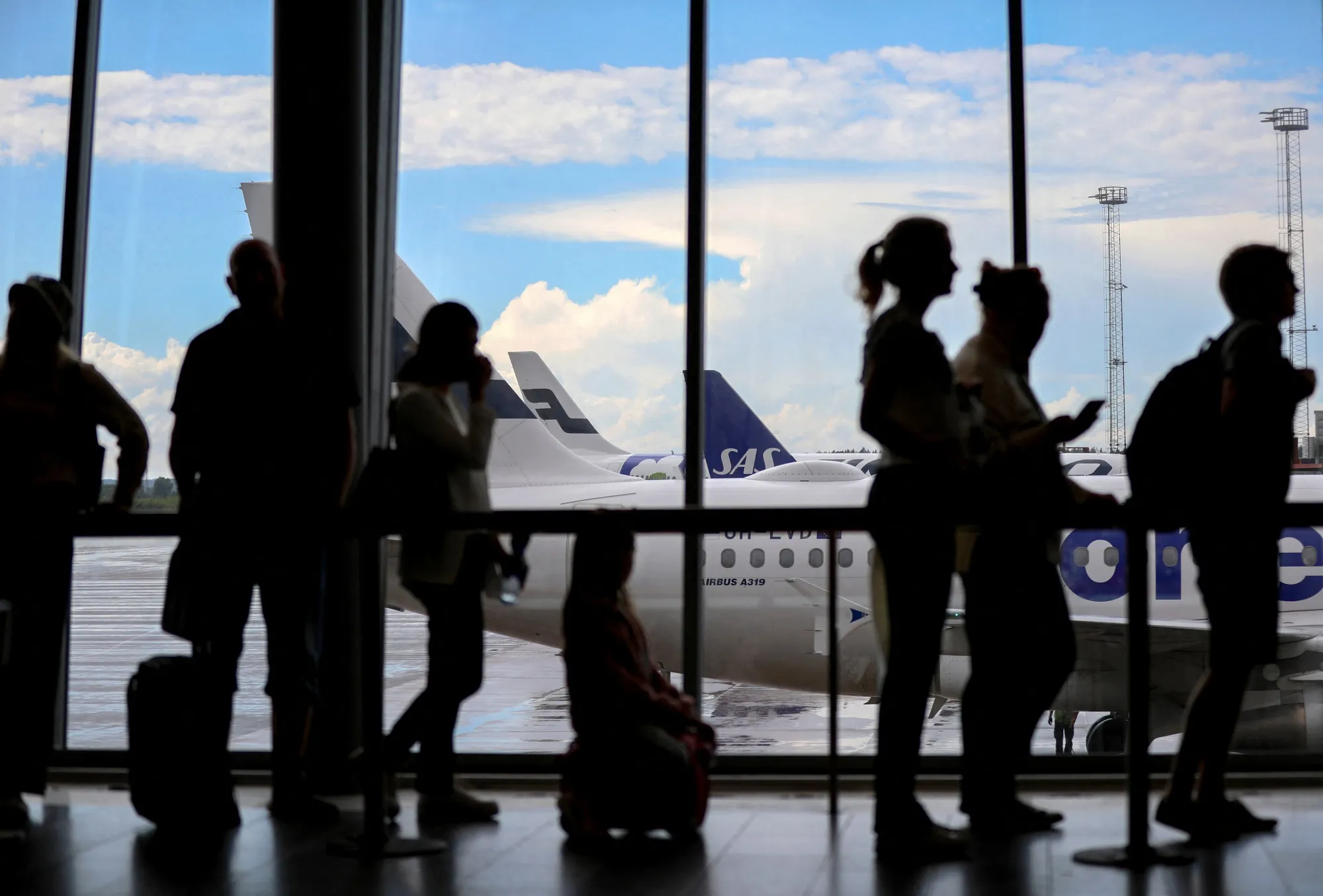 Passengers at the departure hall at Arlanda airport, Stockholm.