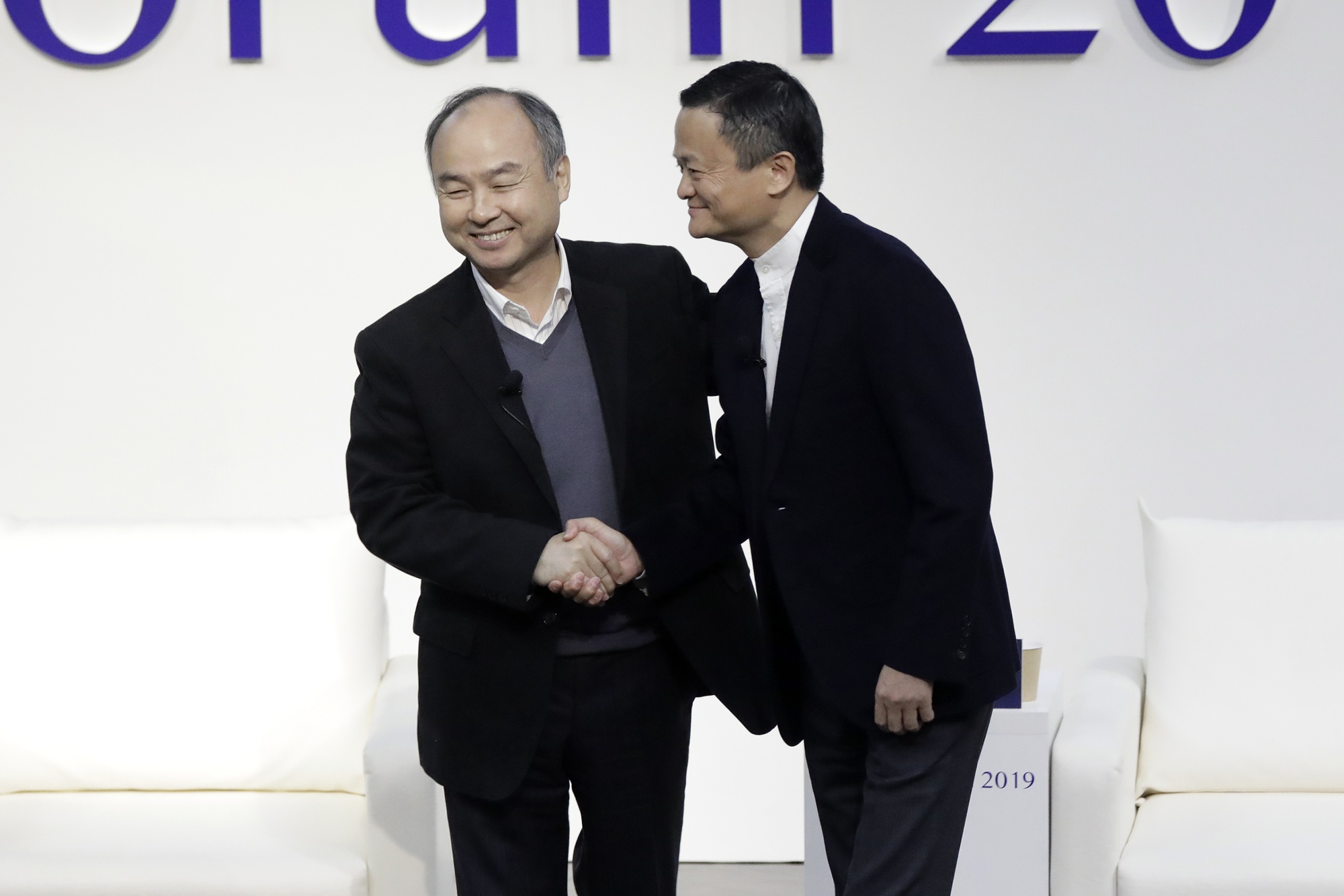 Masayoshi Son, left, and Jack Ma at Tokyo Forum on Dec. 6.