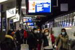 Rush hour morning commuters wear protective face masks while waiting to board a train at Gare du Nord railway station in Paris, France, on Wednesday, Oct. 21, 2020.
