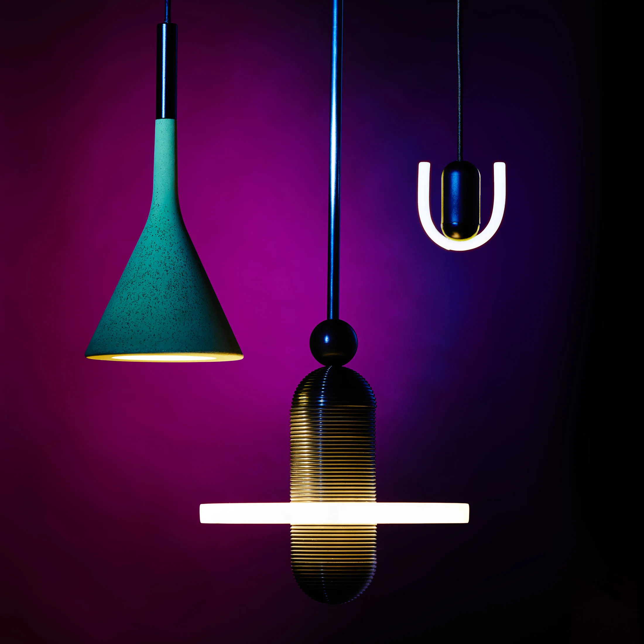From left: Foscarini’s Aplomb, the Median Mono from Apparatus, and Beem’s Smile 01 pendant light.