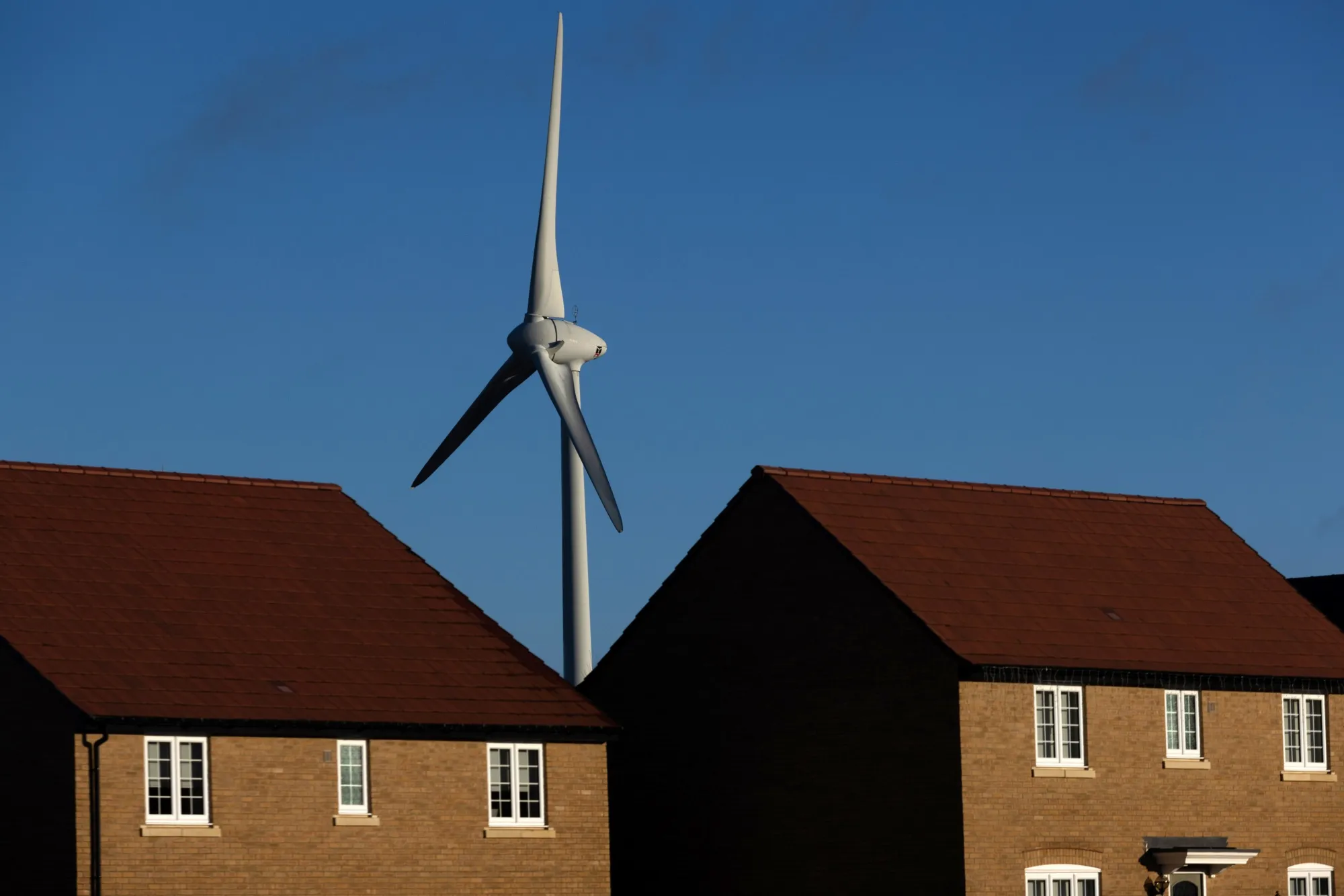 A wind turbine near residential houses near Burton Latimer, UK.