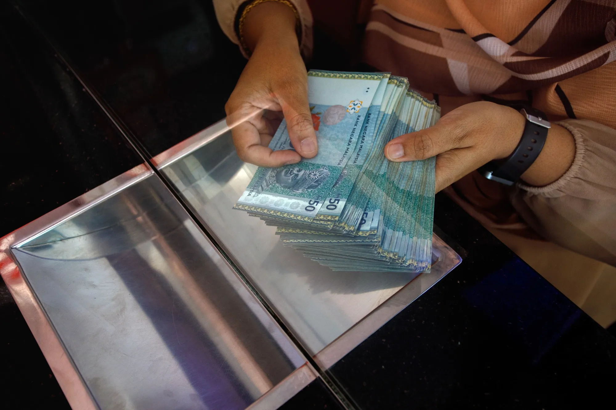 Malaysia’s depreciating currency is set to&nbsp;raise prices&nbsp;of goods and services, posing challenges for authorities as they contemplate their next monetary policy move.