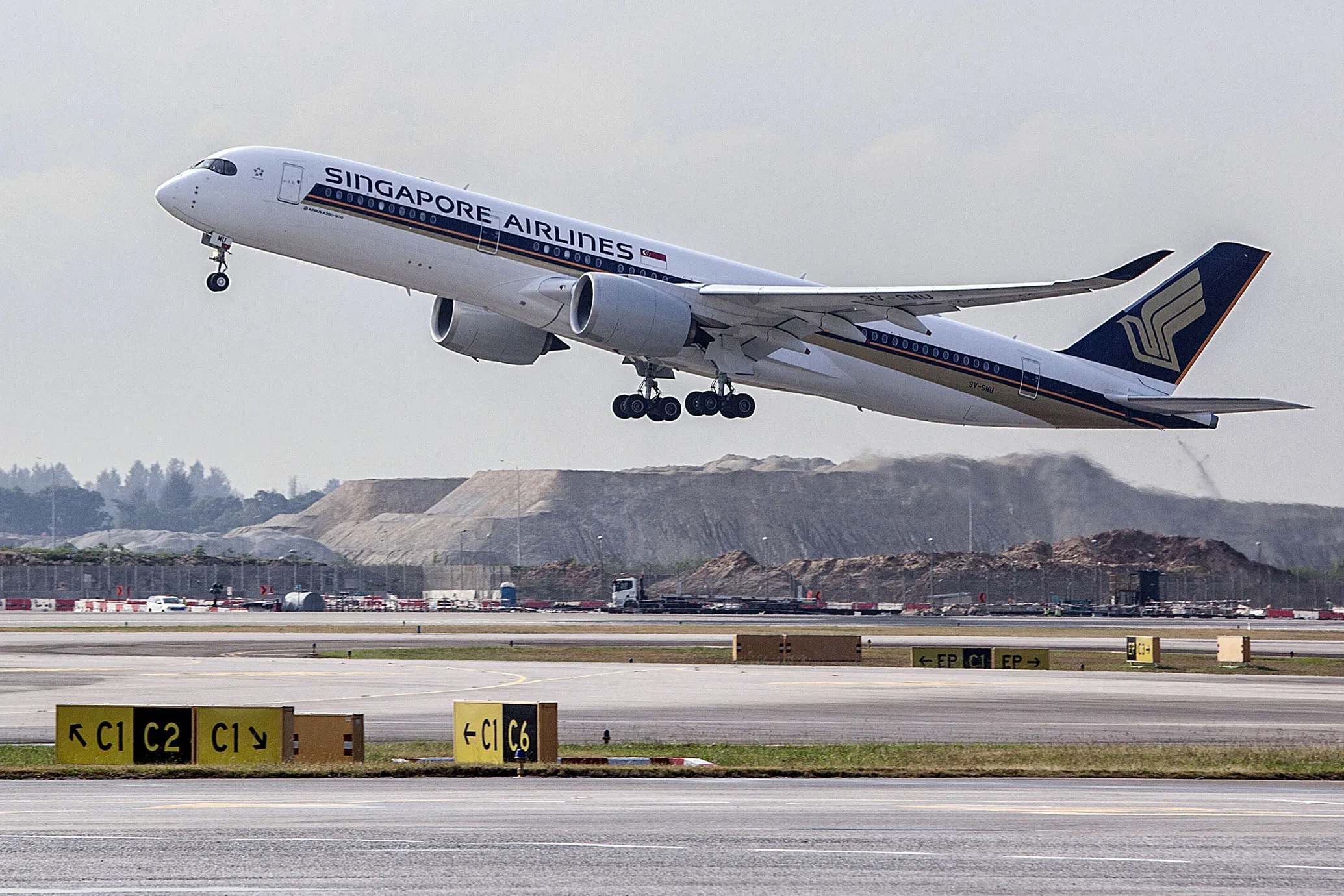 A Singapore Airlines Ltd. (SIA) aircraft takes off from Changi Airport in Singapore.