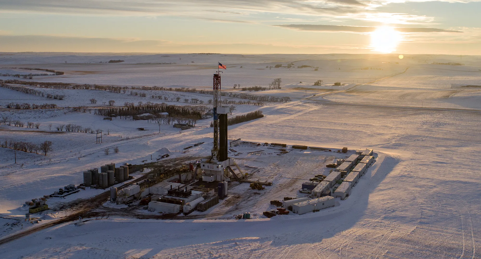 An American flag flies on top of a rig in the Bakken Formation of North Dakota.