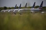 American Airlines Group Inc. Boeing Co. 737 Max planes sit parked outside of a maintenance hangar at Tulsa International Airport (TUL) in Tulsa, Oklahoma, U.S., on Tuesday, May 14, 2019.