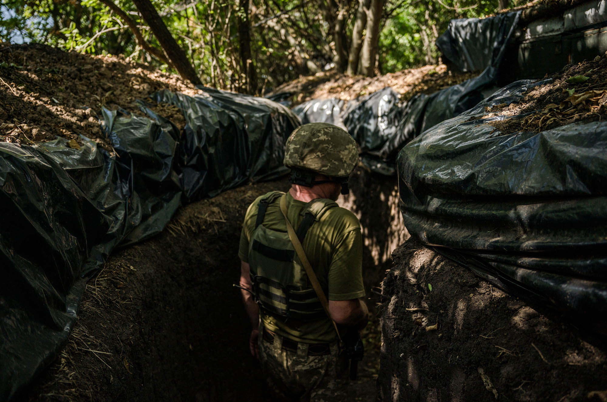 A soldier stands in trenches on the Kherson frontline in the Mykolaiv region of&nbsp;Ukraine, Aug. 8.&nbsp;