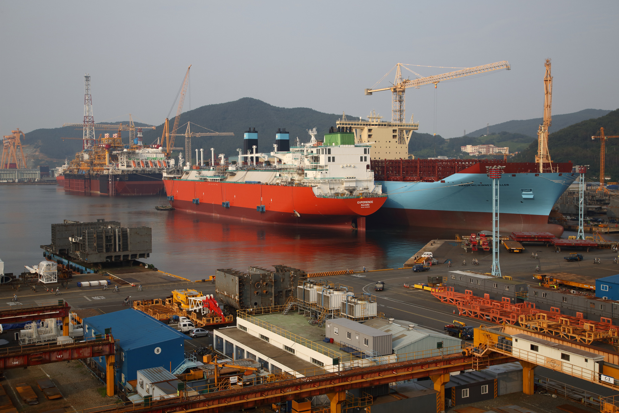 Ships sit moored under construction at the Daewoo Shipbuilding &amp; Marine Engineering shipyard in Geoje, South Korea.
