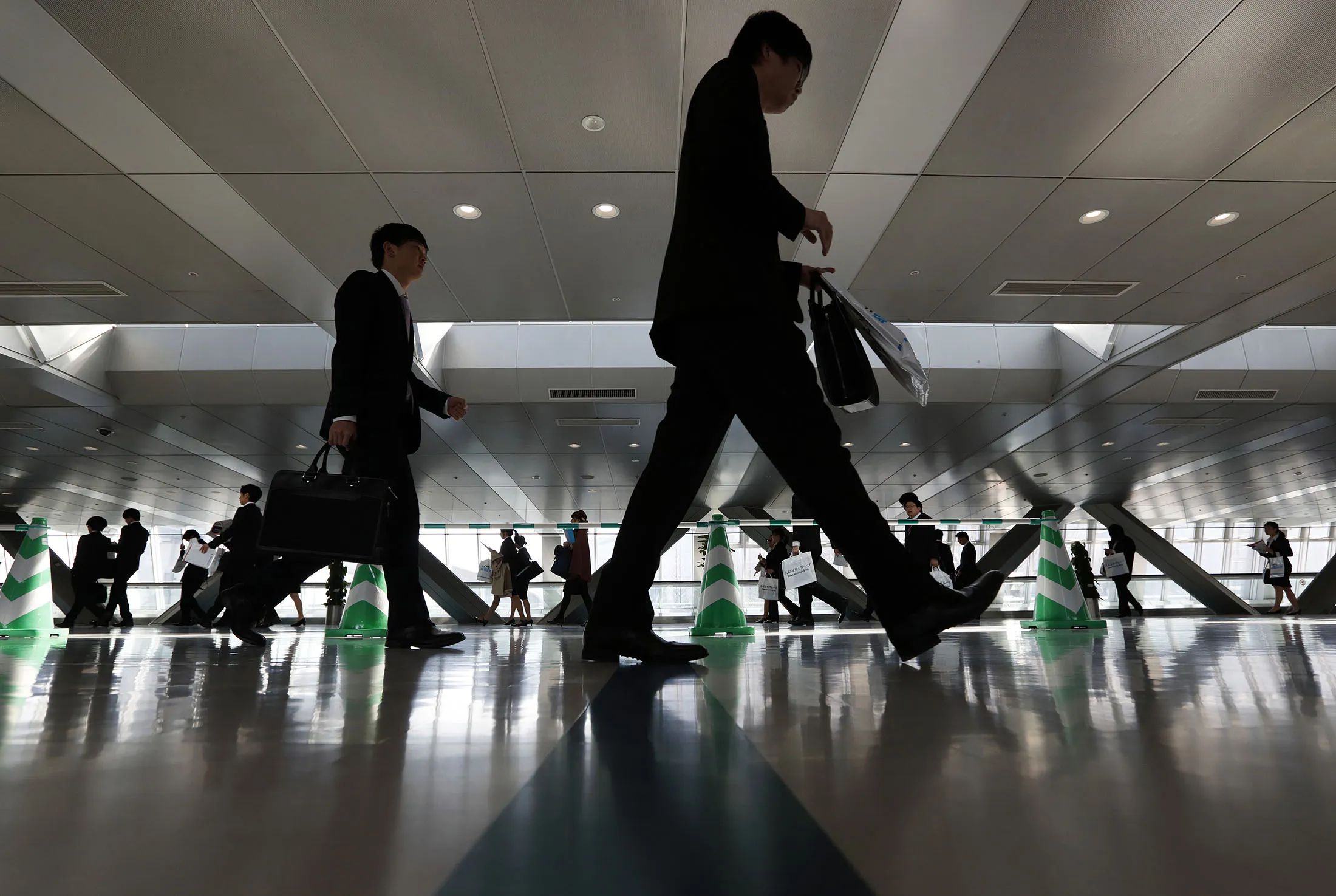 University students walk through a job fair in Tokyo.