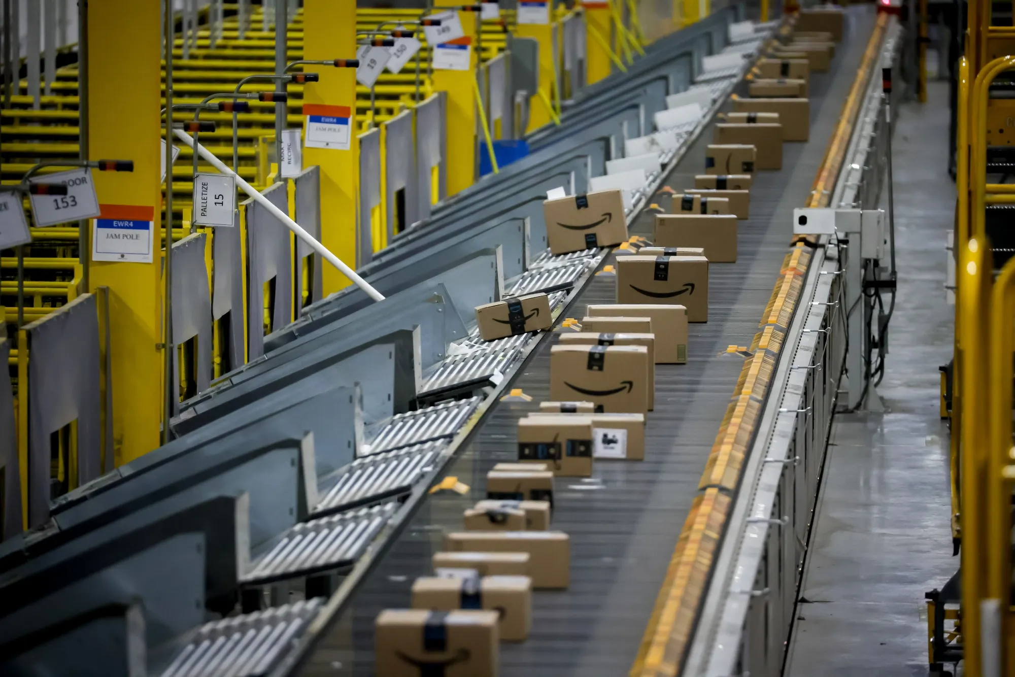 Packages on a conveyor belt are automatically sorted for shipping at an Amazon fulfillment center on Dec. 1 — Cyber Monday — in Robbinsville, New Jersey.