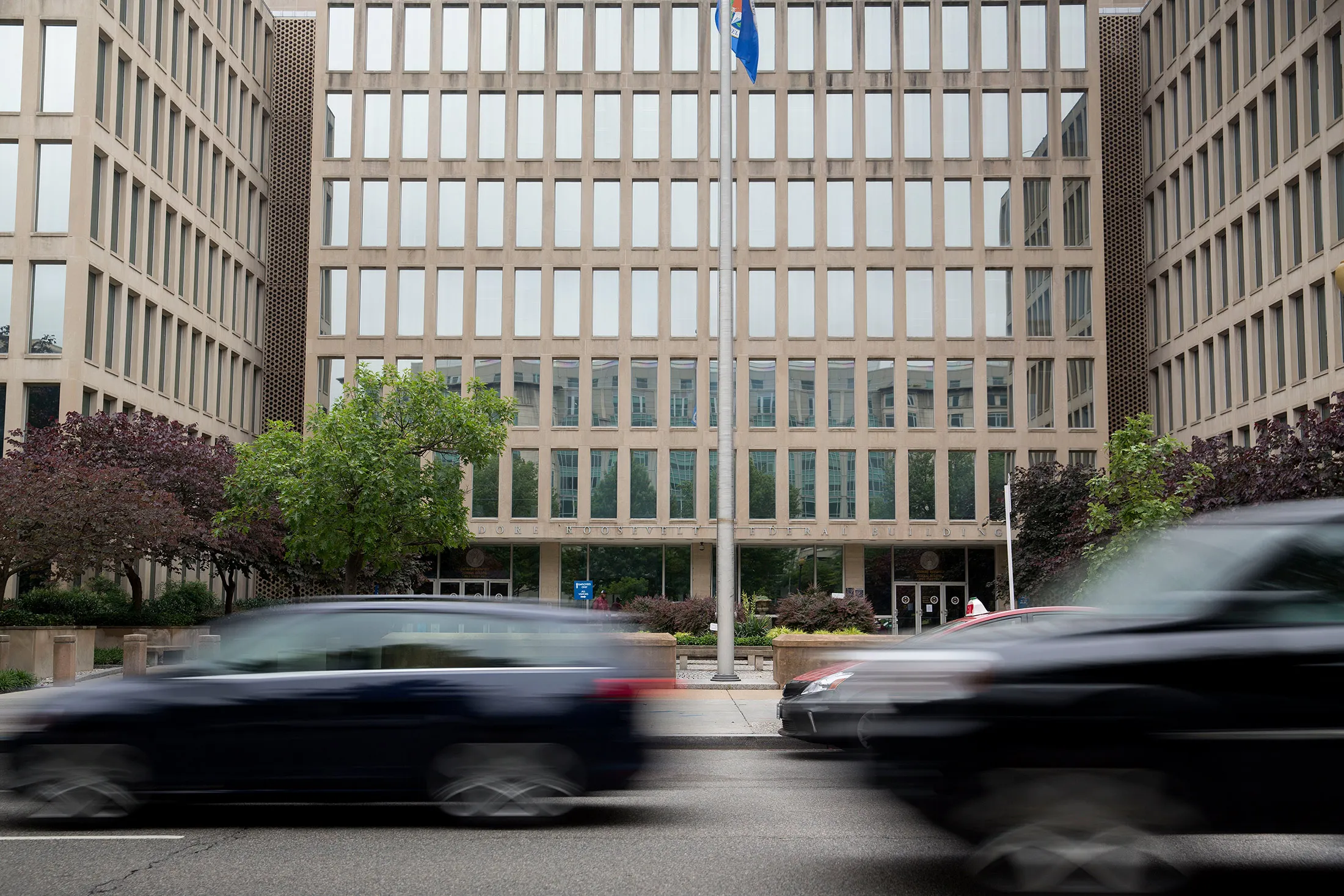 Vehicles drive past the Theodore Roosevelt Building, headquarters of the U.S. Office of Personnel Management (OPM), in Washington, D.C.
