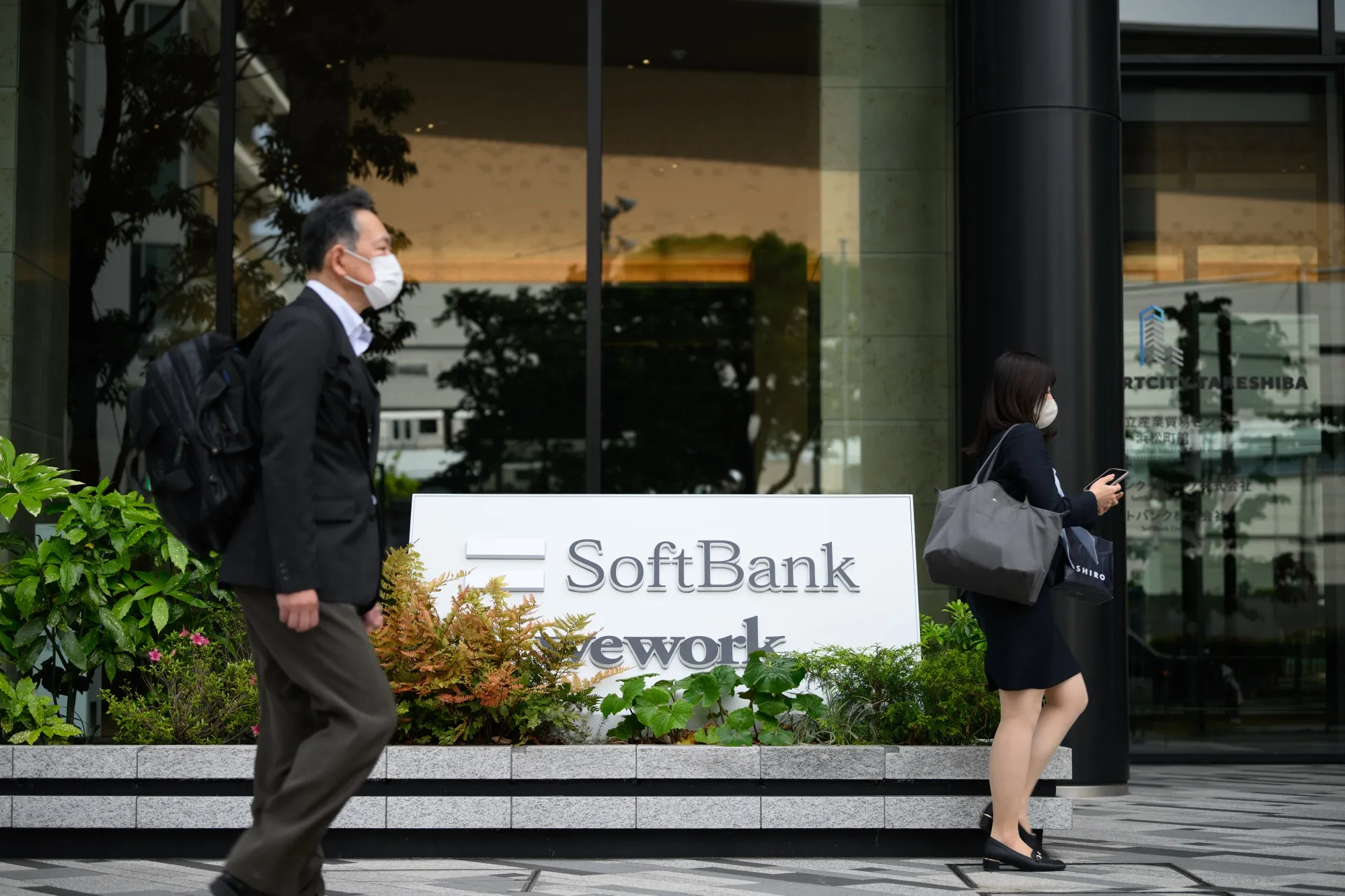 The SoftBank logo outside the Tokyo Portcity Takeshiba building, which houses the company's headquarters, in Tokyo, Japan, on Tuesday, May 9, 2023. SoftBank Group is scheduled to release earnings figures on May 11.