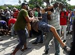 A man is arrested during a demonstration against the government of Cuban President Miguel Diaz-Canel in Havana on Sunday.