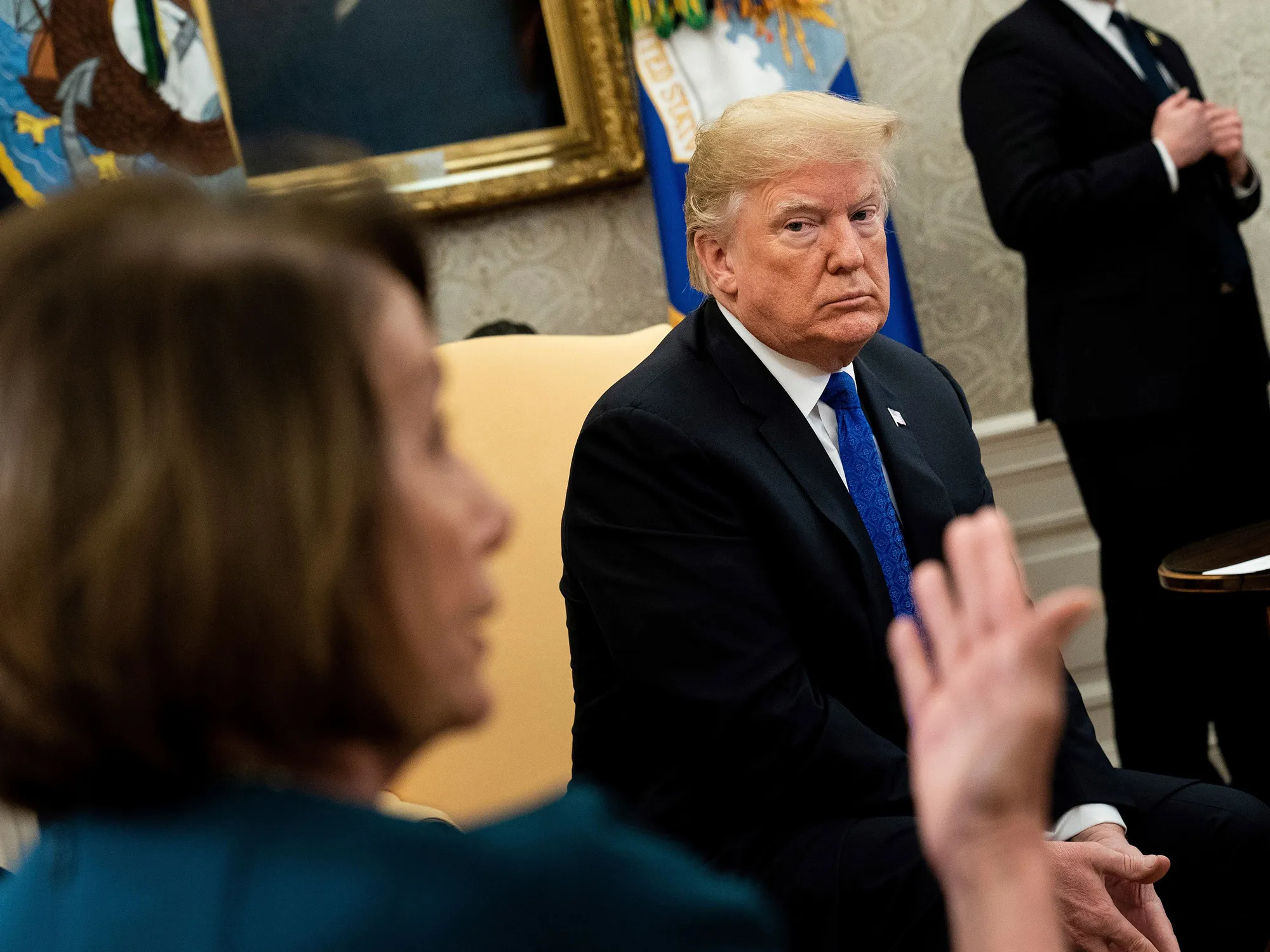 Donald Trump&nbsp;listens while Nancy Pelosi&nbsp;speaks before a meeting at the White House Dec. 11, 2018.