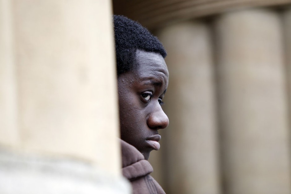 Justus Radford, a student from Grover Cleveland High School, looks on during a rally and Buffalo schools boycott at City Hall in Buffalo, N.Y., Monday, May 16, 2011. Some parents in Buffalo kept their children out of class and gathered on the steps of City Hall to protest the city school system's low graduation rates and under performing schools. 