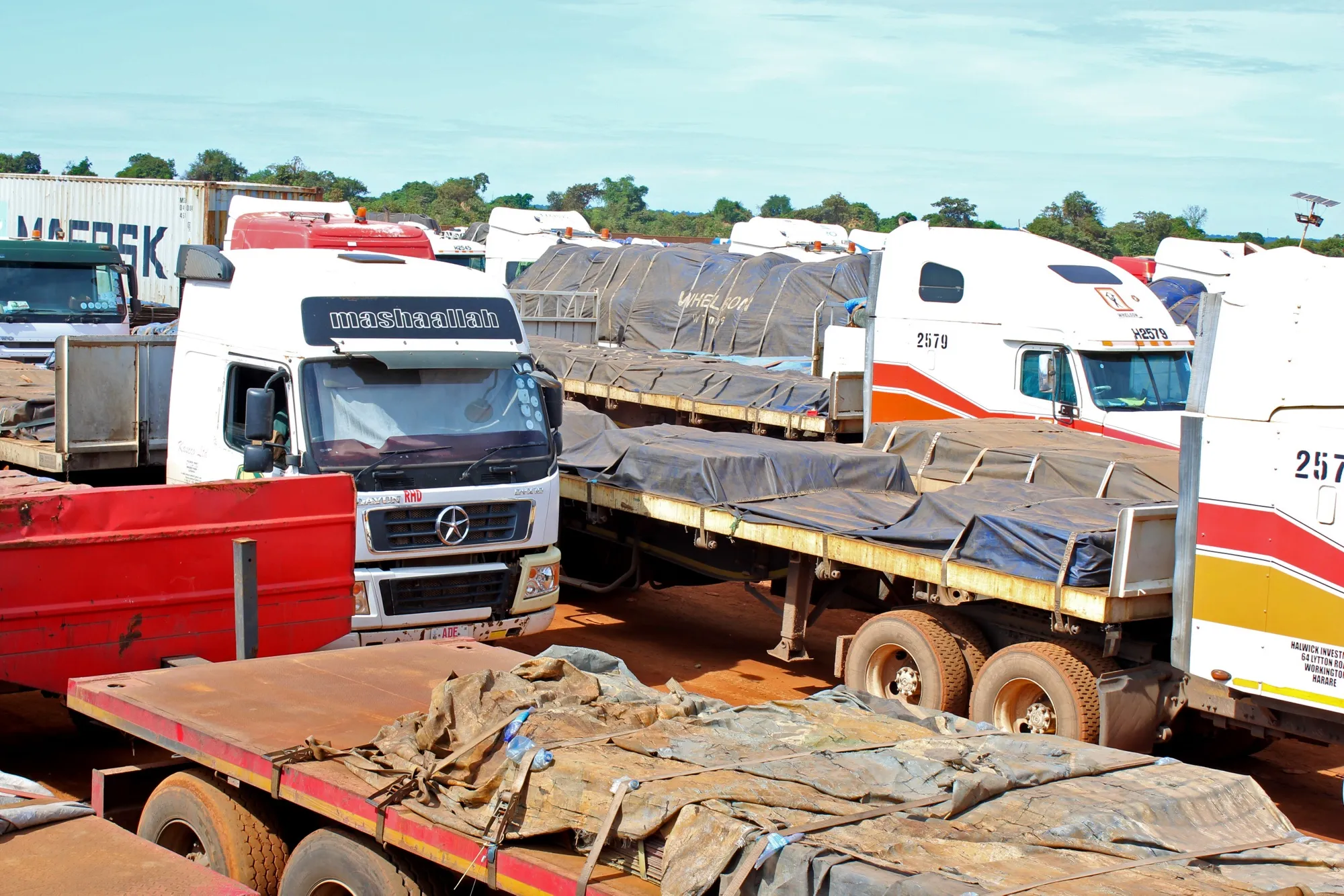 Haulage trucks carrying copper and cobalt for export on the toll road between Lubumbashi and Kasumbalesa in Democratic Republic of Congo.