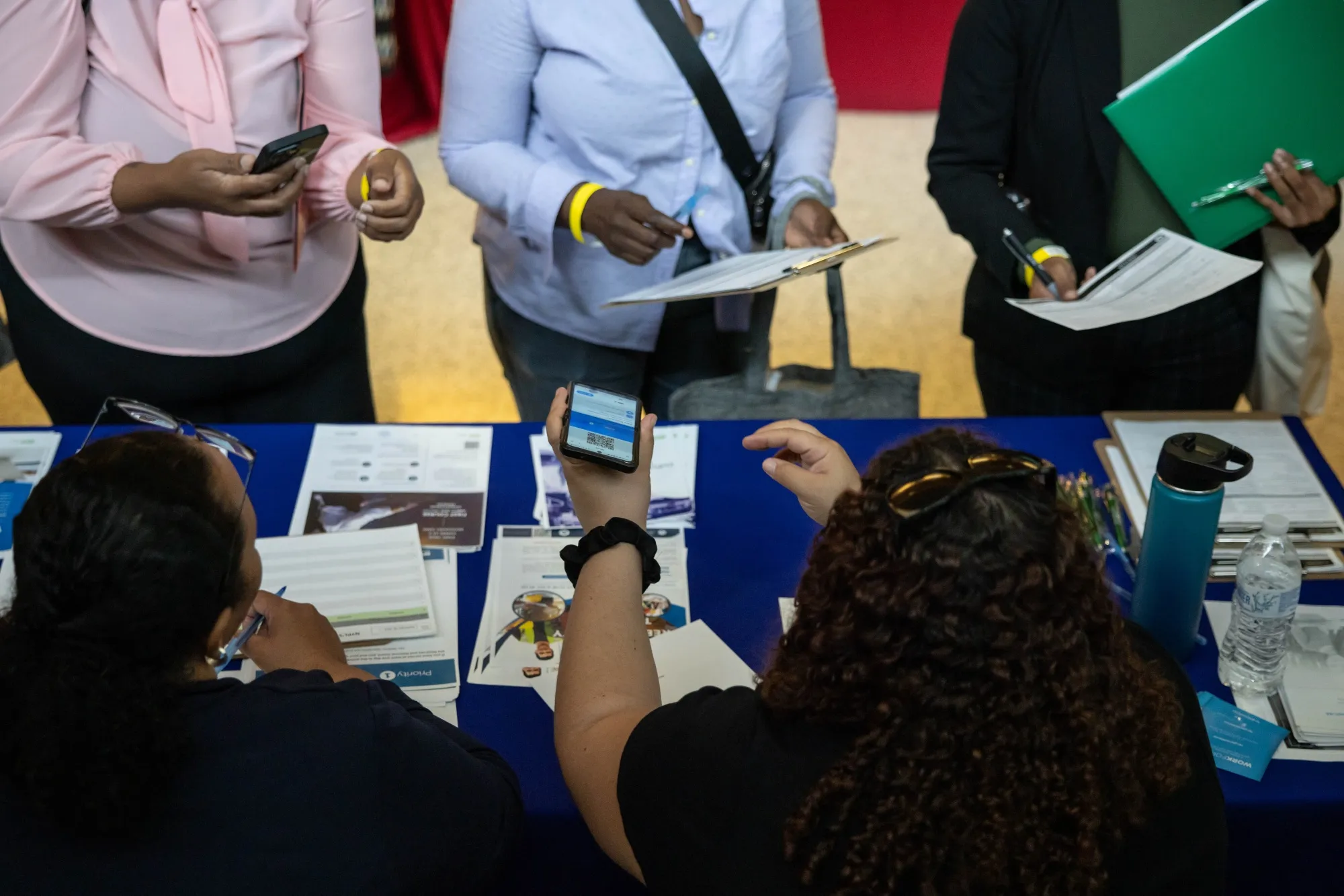 Jobseekers talk to recruiters at a job fair in&nbsp;New York.