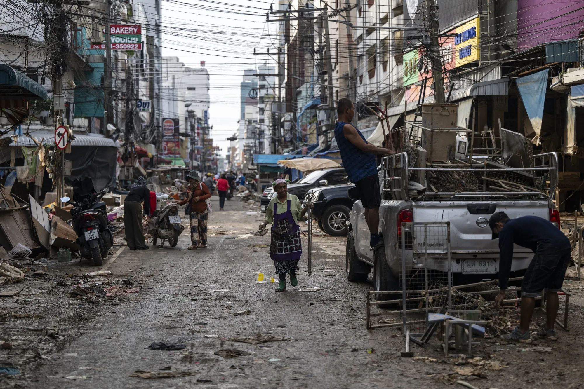 People clean up damage in Hat Yai on Nov. 29.