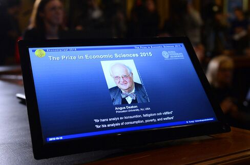 A photograph of Professor Angus Deaton is displayed at a press conference to announce the 2015 Nobel Economics Prize.