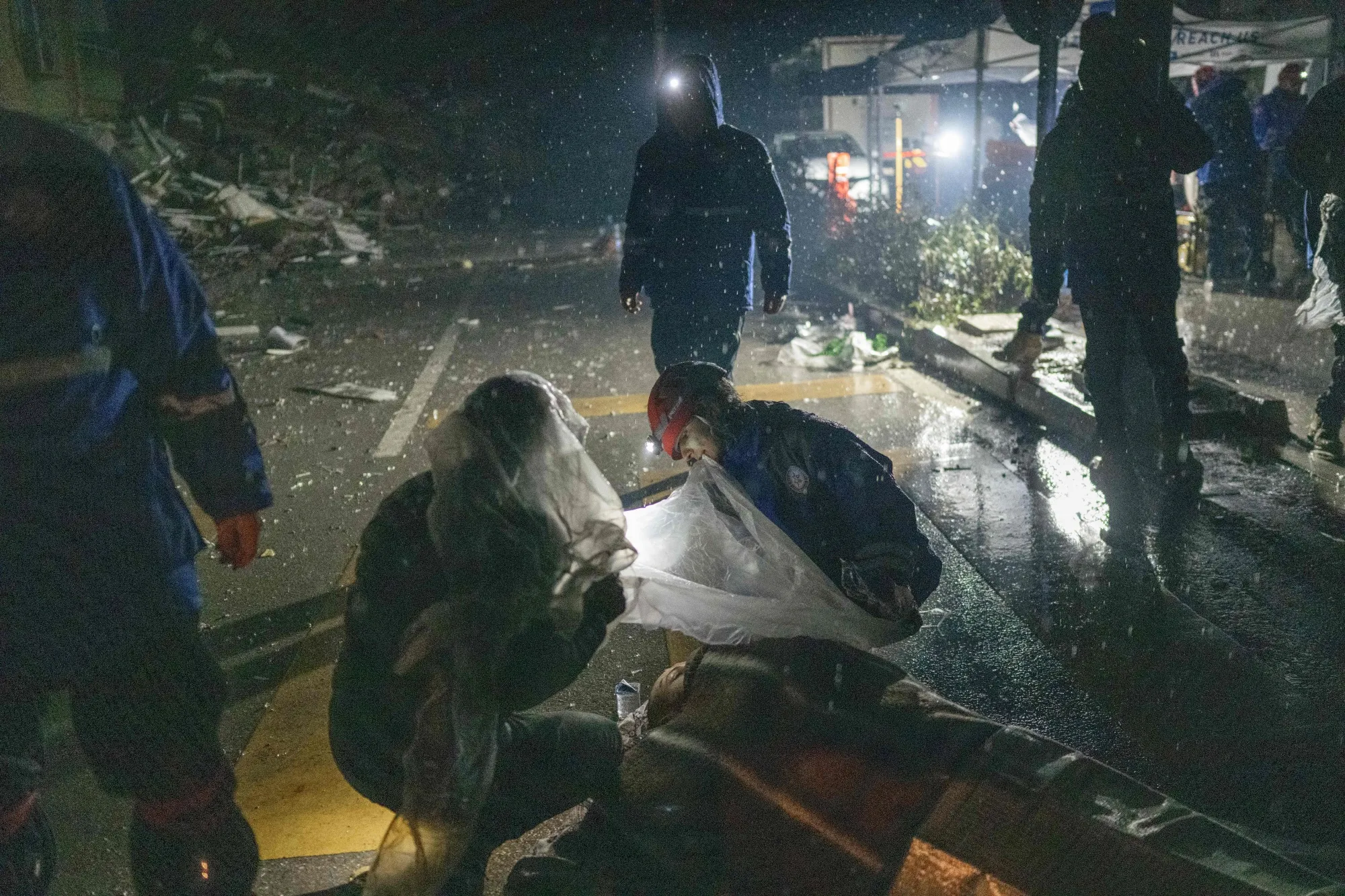 Rescue workers attend to the wounded in Hatay, Turkey, on Monday.