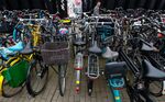 A man walks past a bike parking area near Amsterdam Central Station.