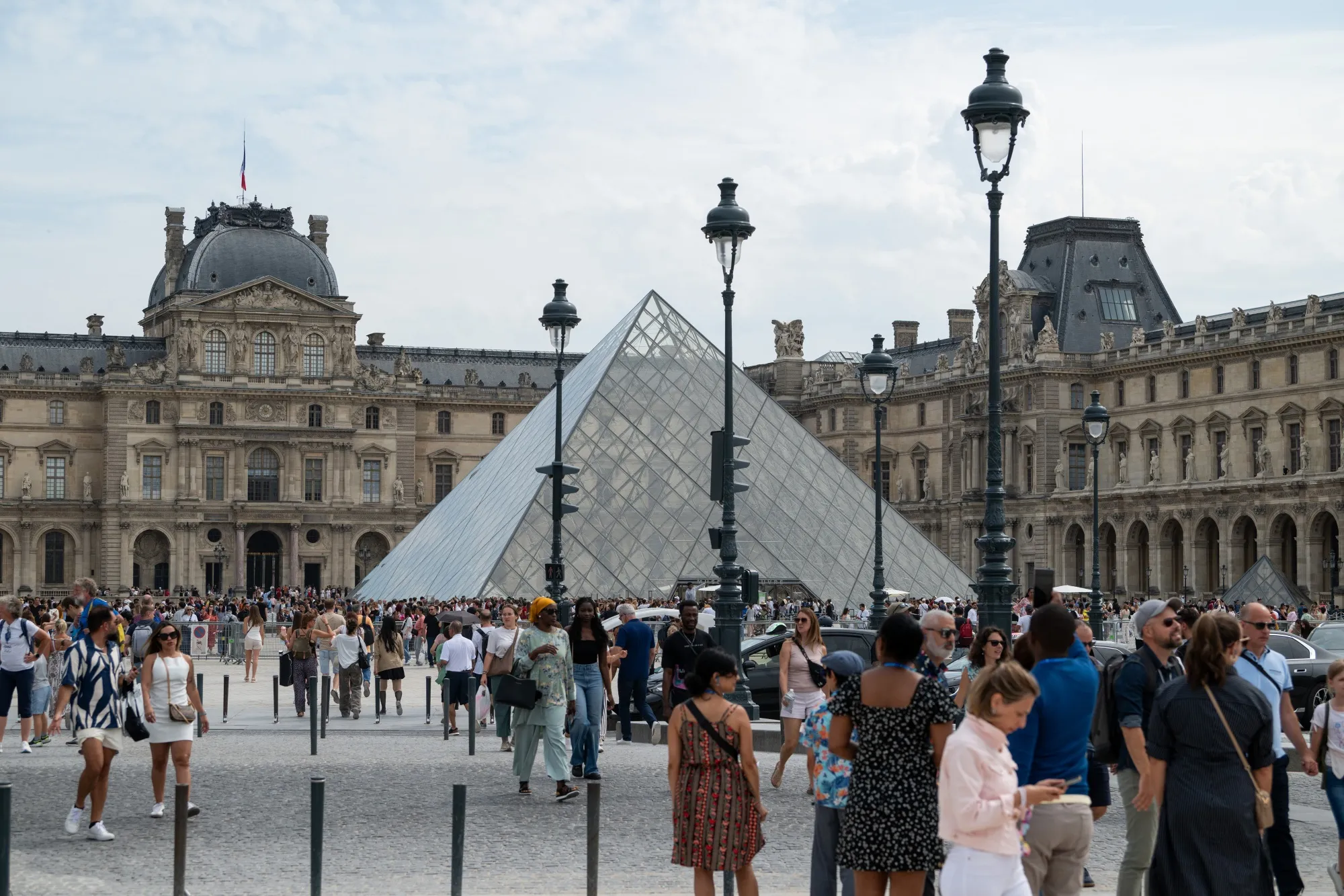 Tourists at the Louvre art museum in Paris, France, on Aug. 19.