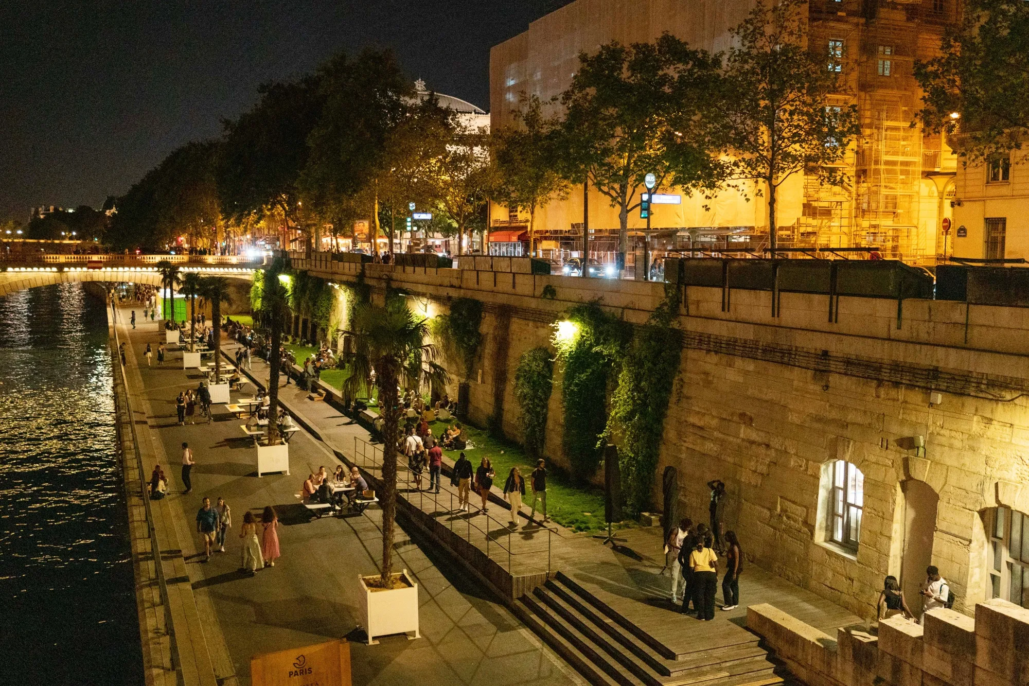 Lit street lights on the river banks of the Seine in Paris.