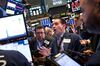 Traders work on the floor of the New York Stock Exchange (NYSE).