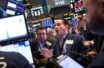 Traders work on the floor of the New York Stock Exchange (NYSE).