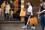 Shoppers&nbsp;walk past a Louis Vuitton store in Hong Kong, China&nbsp;on July 8.&nbsp;