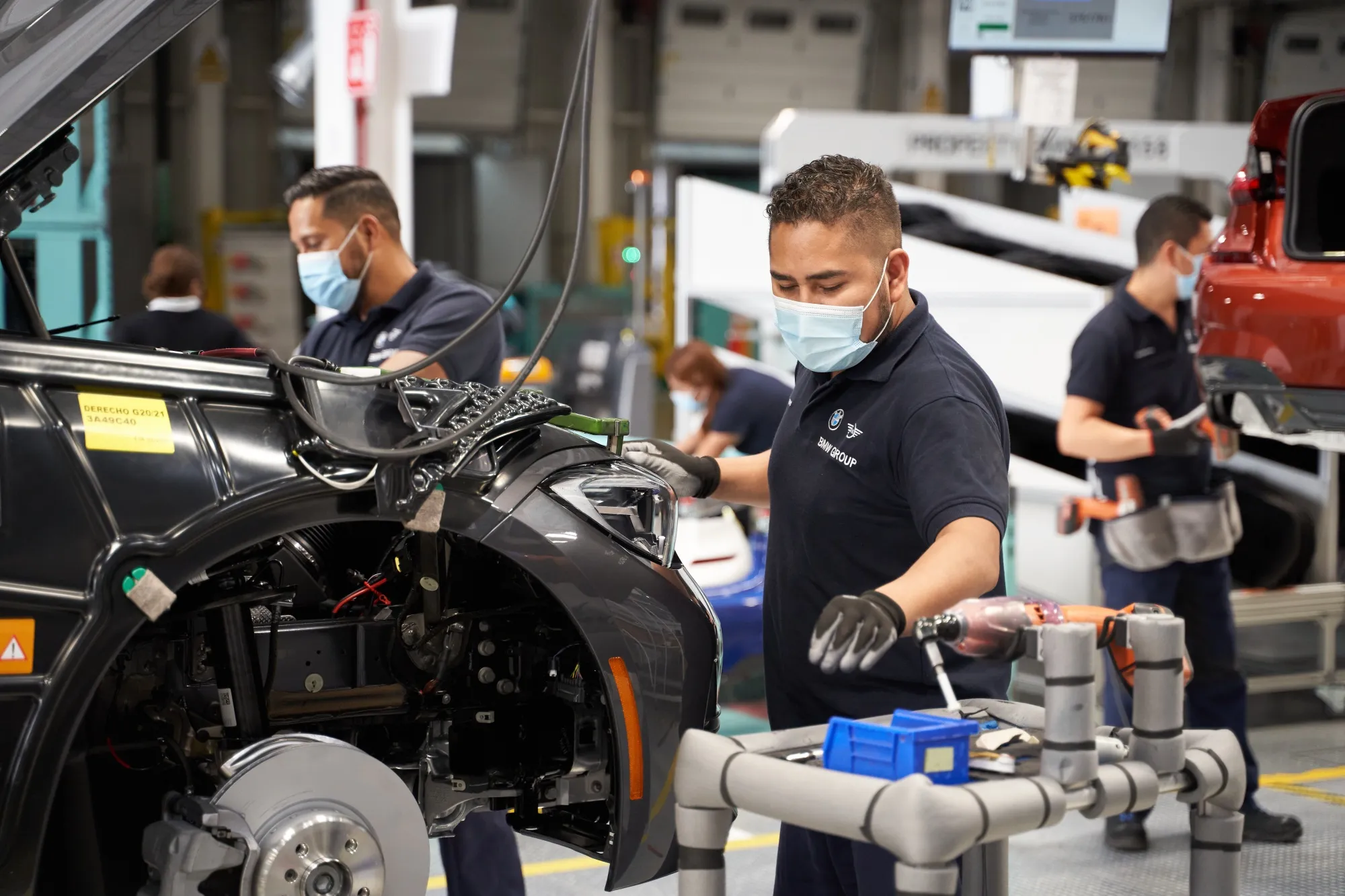 Employees assemble components of BMW&nbsp;Series 3 vehicles on the production floor in San Luis Potosi, Mexico.