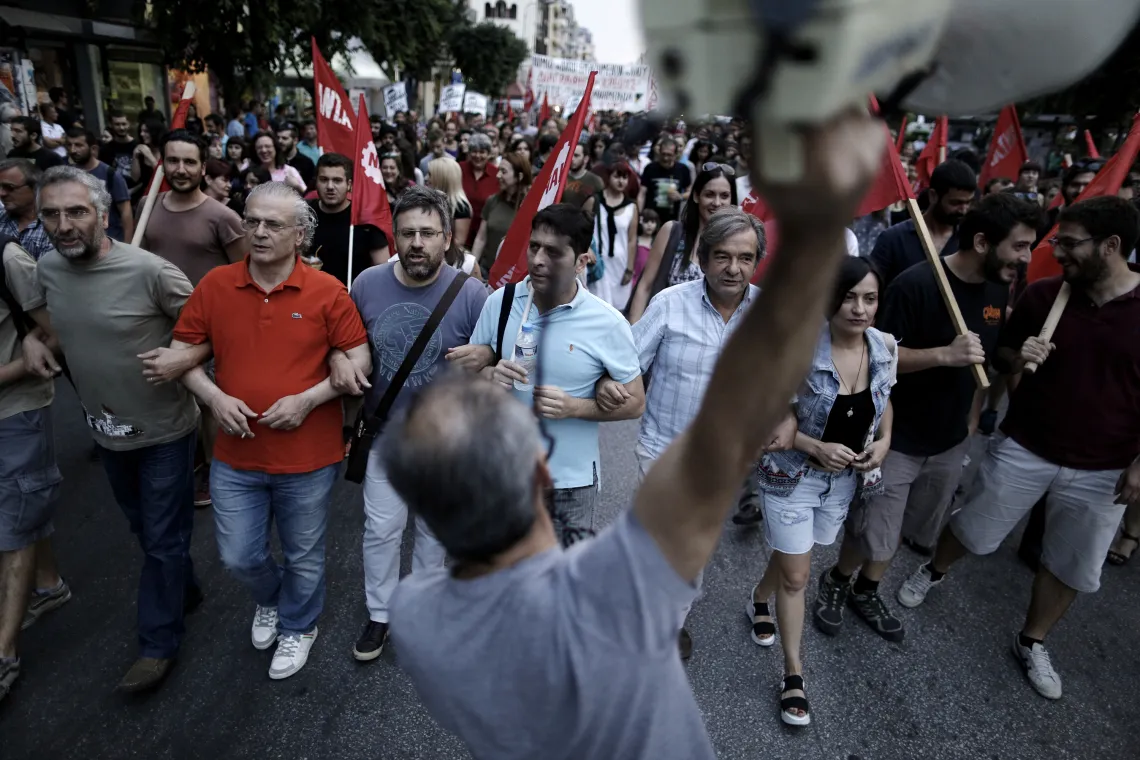 A protester shouts anti-European slogans with a megaphone during an anti-austerity demonstration in Thessaloniki, Greece, on Sunday, June 28, 2015. Photographer: Konstantinos Tsakalidis/Bloomberg
