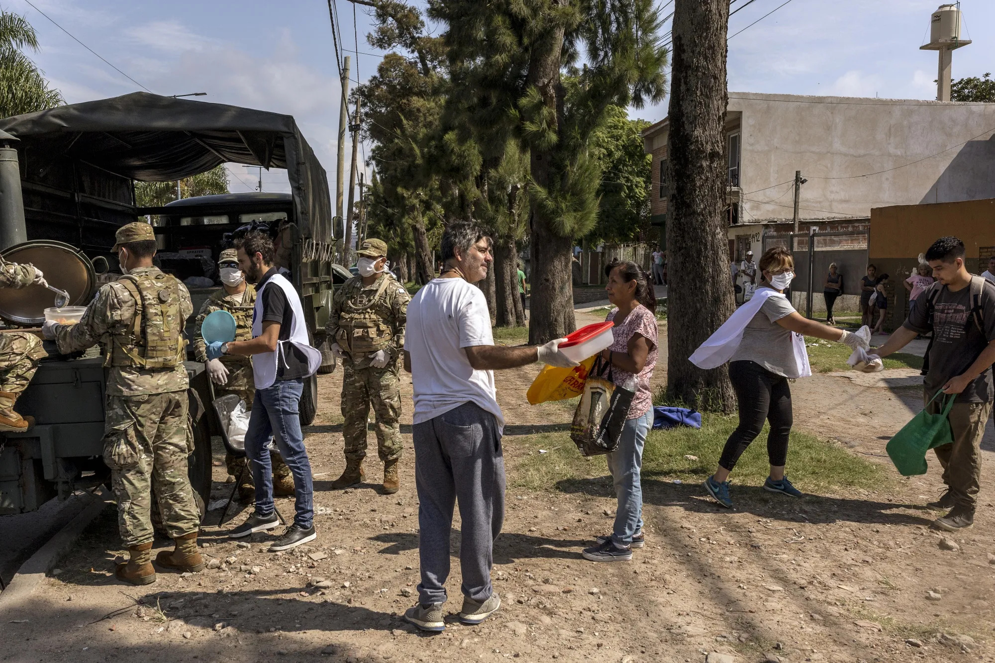 Members of the Argentinean military distribute food to people affected by the coronavirus lockdown in Quilmes, Province of Buenos Aires, Argentina.