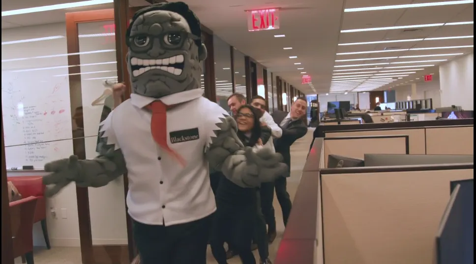 Mr. Stone leads a conga line.