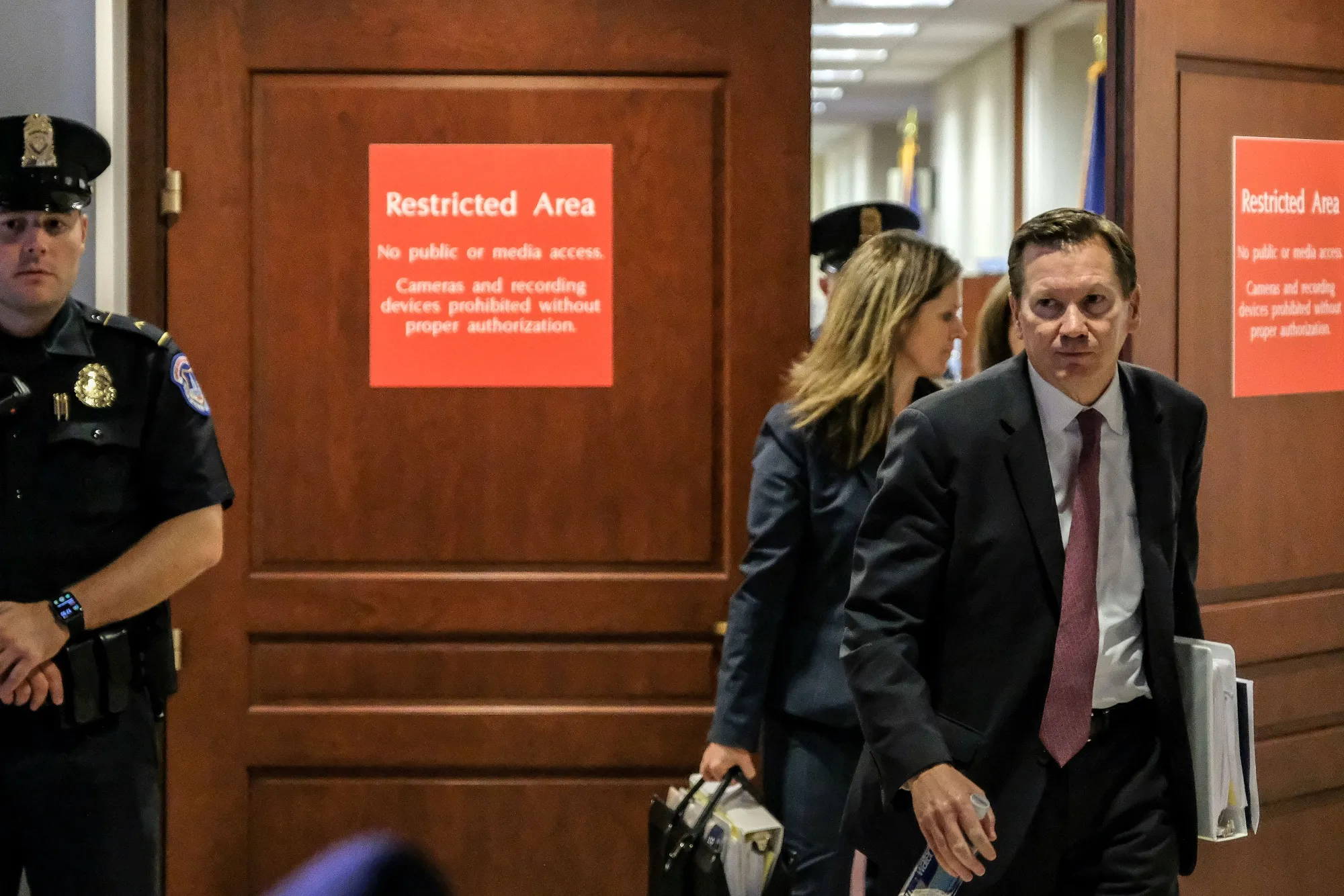 Michael&nbsp;Atkinson, right, leaves a closed briefing with the House Intelligence Committee on Capitol Hill in 2019.