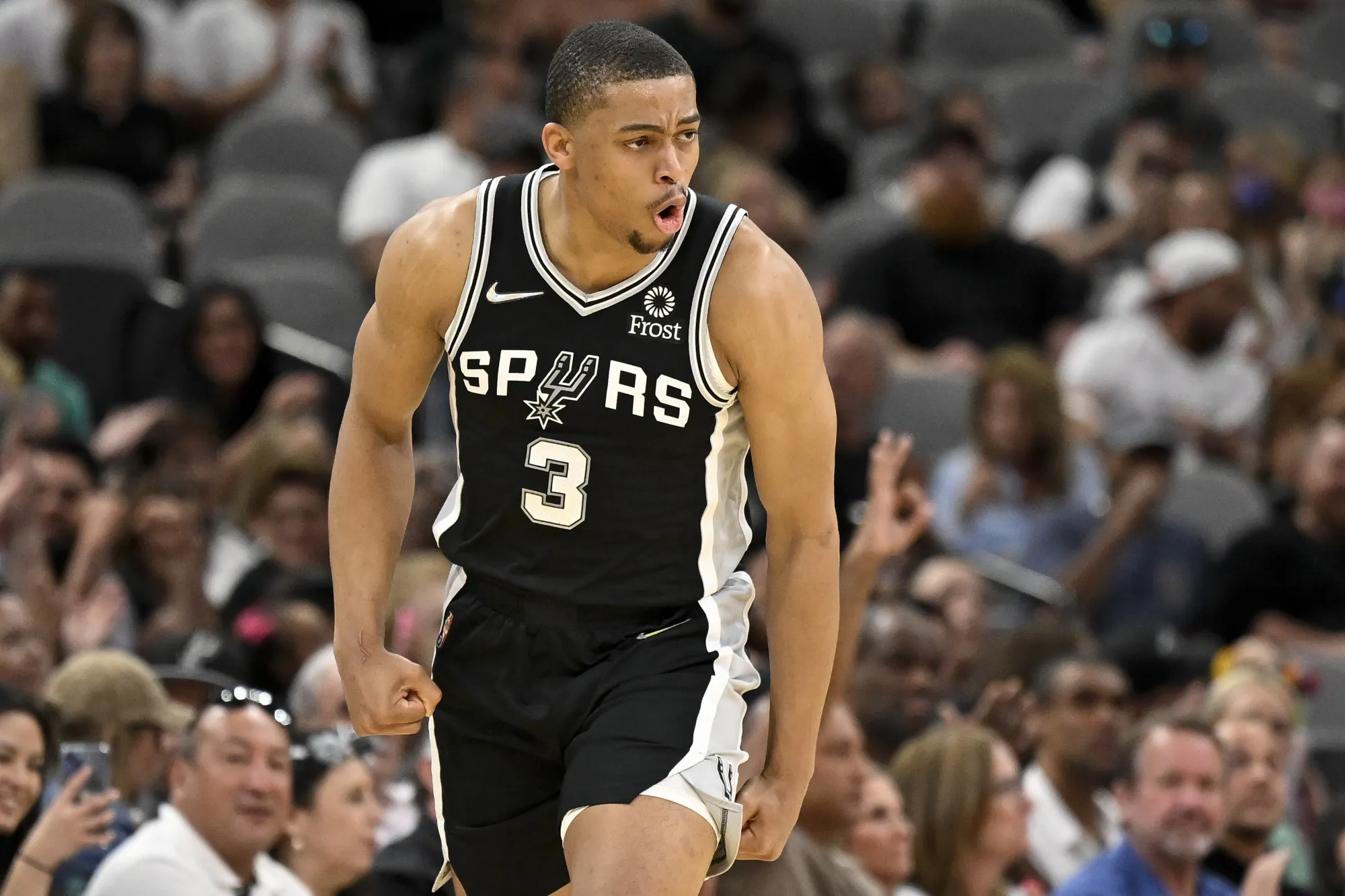 San Antonio Spurs' Keldon Johnson celebrates after a basket during the first half of an NBA basketball game against the Portland Trail Blazers on Sunday, April 3, 2022, in San Antonio. (AP Photo/Darren Abate)