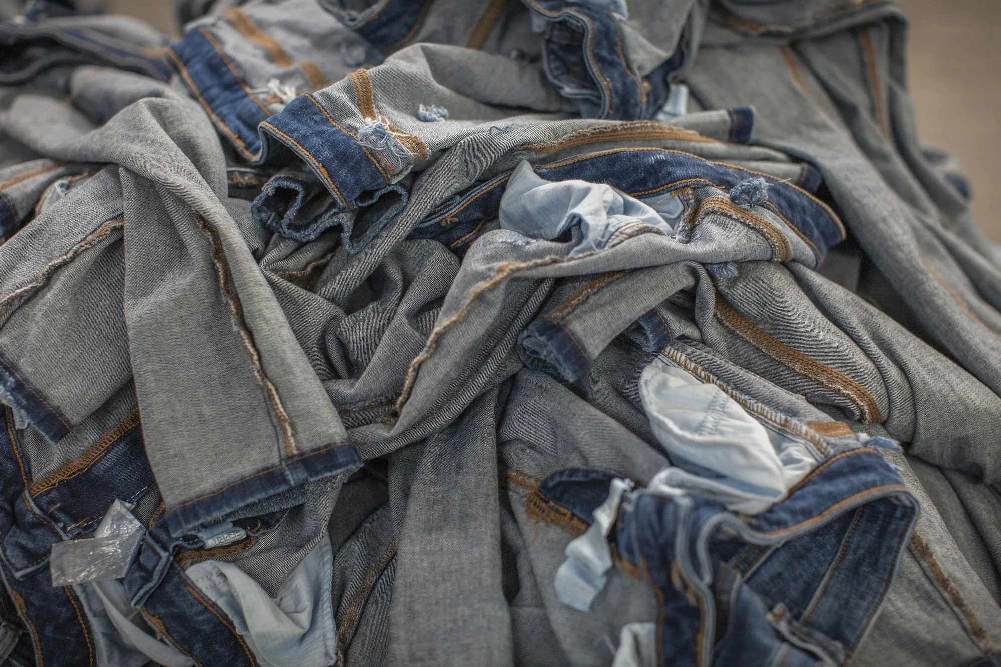 A pile of&nbsp;jeans sits in a clothing factory in Karachi, Pakistan.
